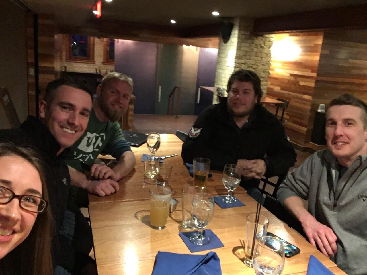 JT with friends around a restaurant table